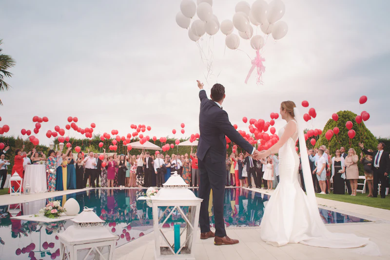 Candid wedding moment between guests